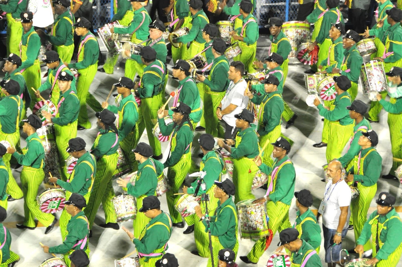 Samba school members in green costumes with drums in the Sambadrome, Rio de Janeiro