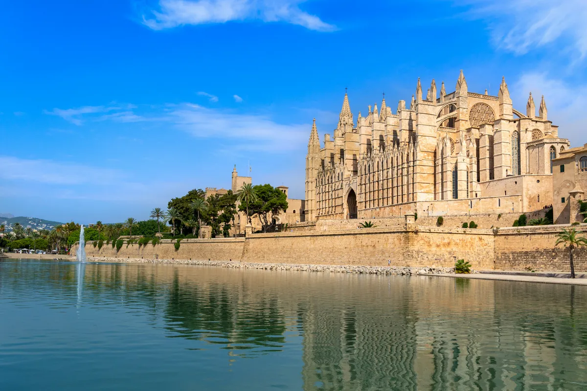 Palma Cathedral above the Parc de la Mar lake in Mallorca, Spain