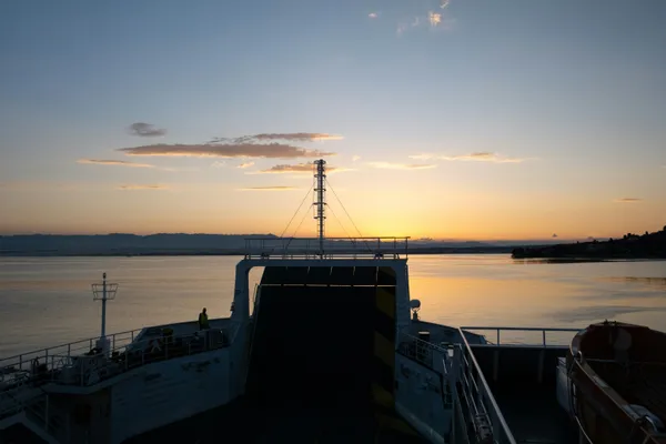 Car ferry deck at sunset in Preko on Ugljan island, Croatia, looking across the channel towards Zadar